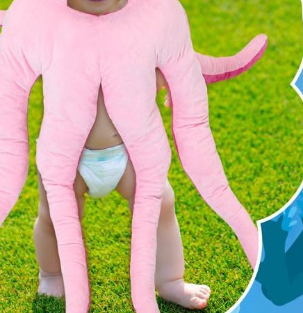 Toddler standing on grass wearing the octopus costume